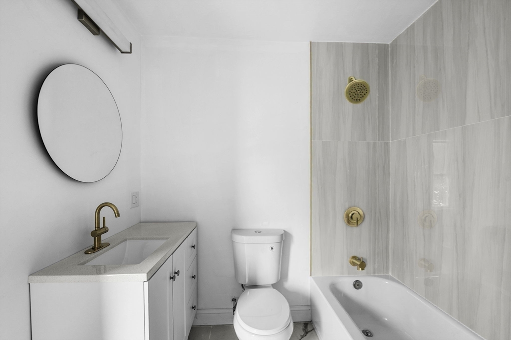 83 Arnold Street Methuen, MA 01844 - Photo 24 of 42 a bathroom with a sink and a mirror