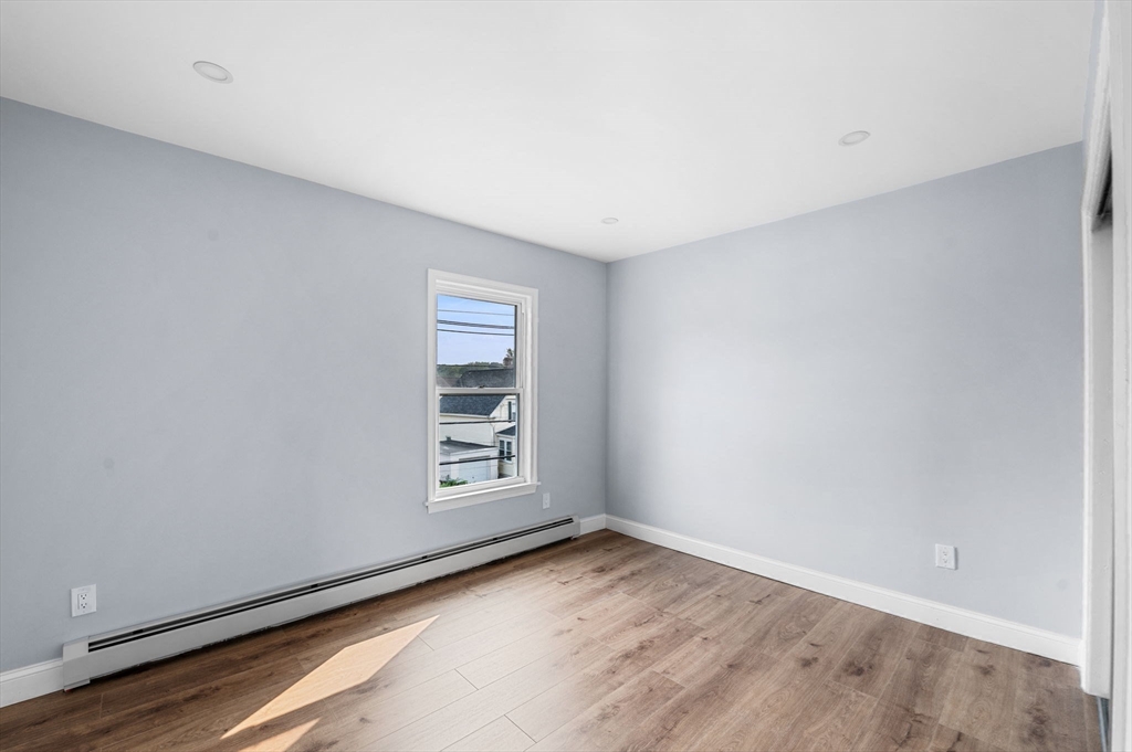 83 Arnold Street Methuen, MA 01844 - Photo 30 of 42 wooden floor in an empty room
