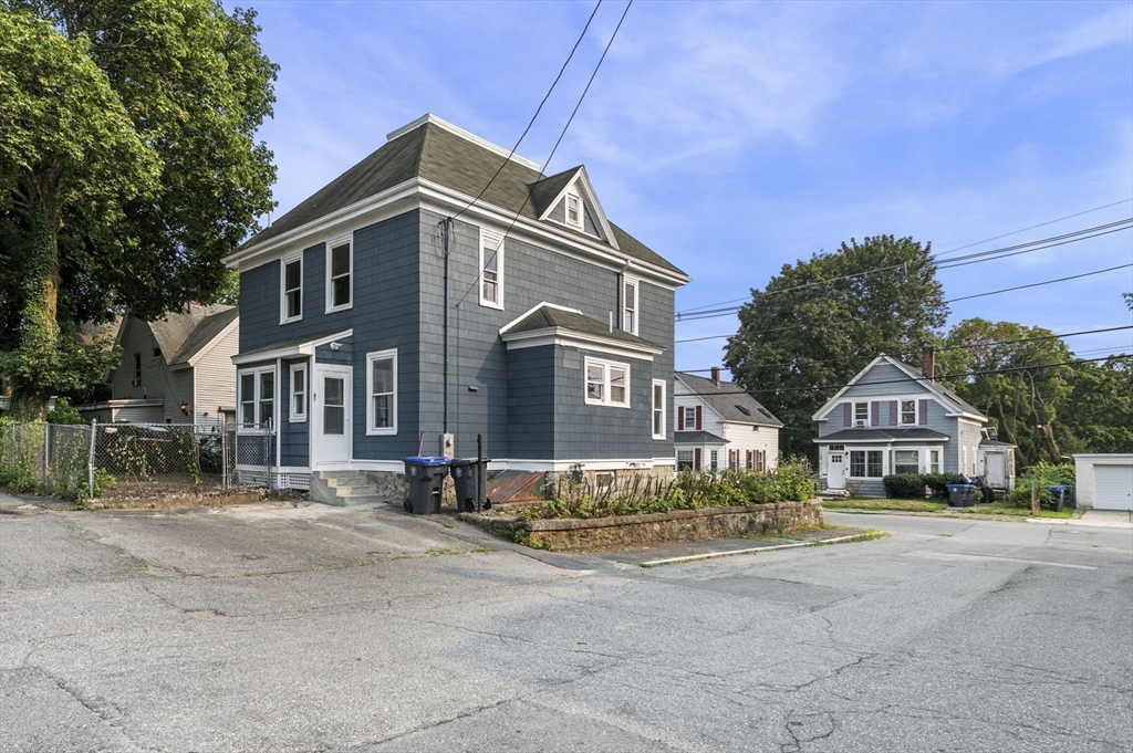 83 Arnold Street Methuen, MA 01844 - Photo 3 of 42 a front view of a house with a yard