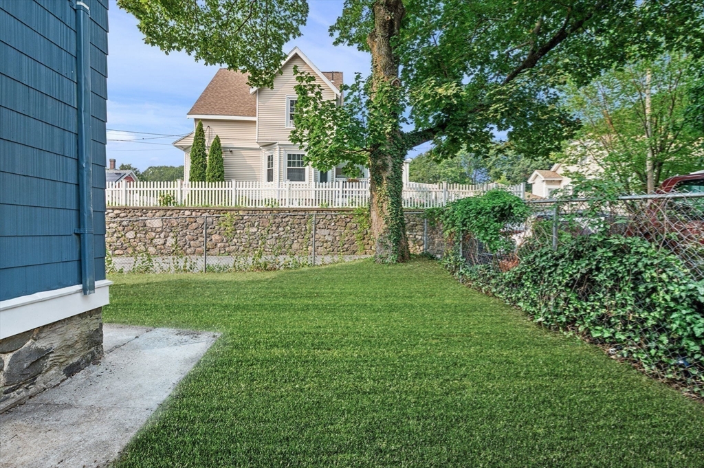 83 Arnold Street Methuen, MA 01844 - Photo 40 of 42 a view of house with a yard