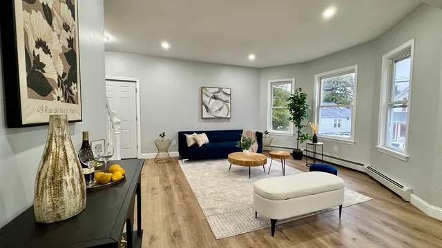 a living room with furniture and a table