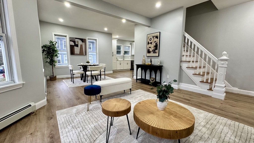 83 Arnold Street Methuen, MA 01844 - Photo 9 of 42 a living room with furniture and a wooden floor
