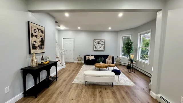 a living room with furniture and a large window