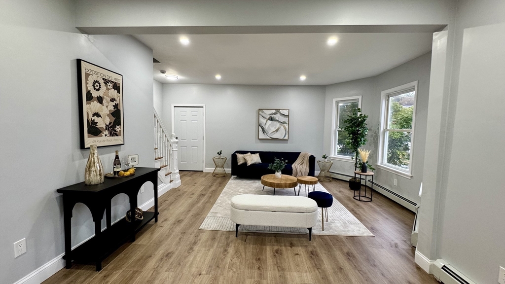 83 Arnold Street Methuen, MA 01844 - Photo 10 of 42 a living room with furniture and a large window