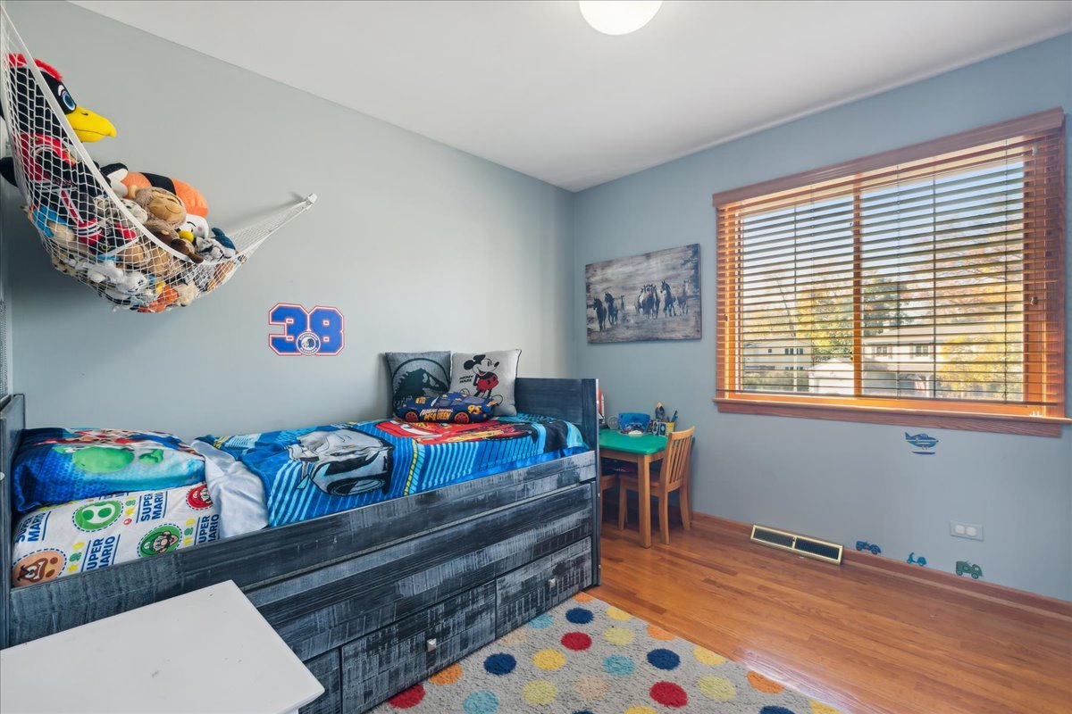 203 Pine Street Deerfield, IL 60015 - Photo 14 of 24 a bed room with furniture and a window