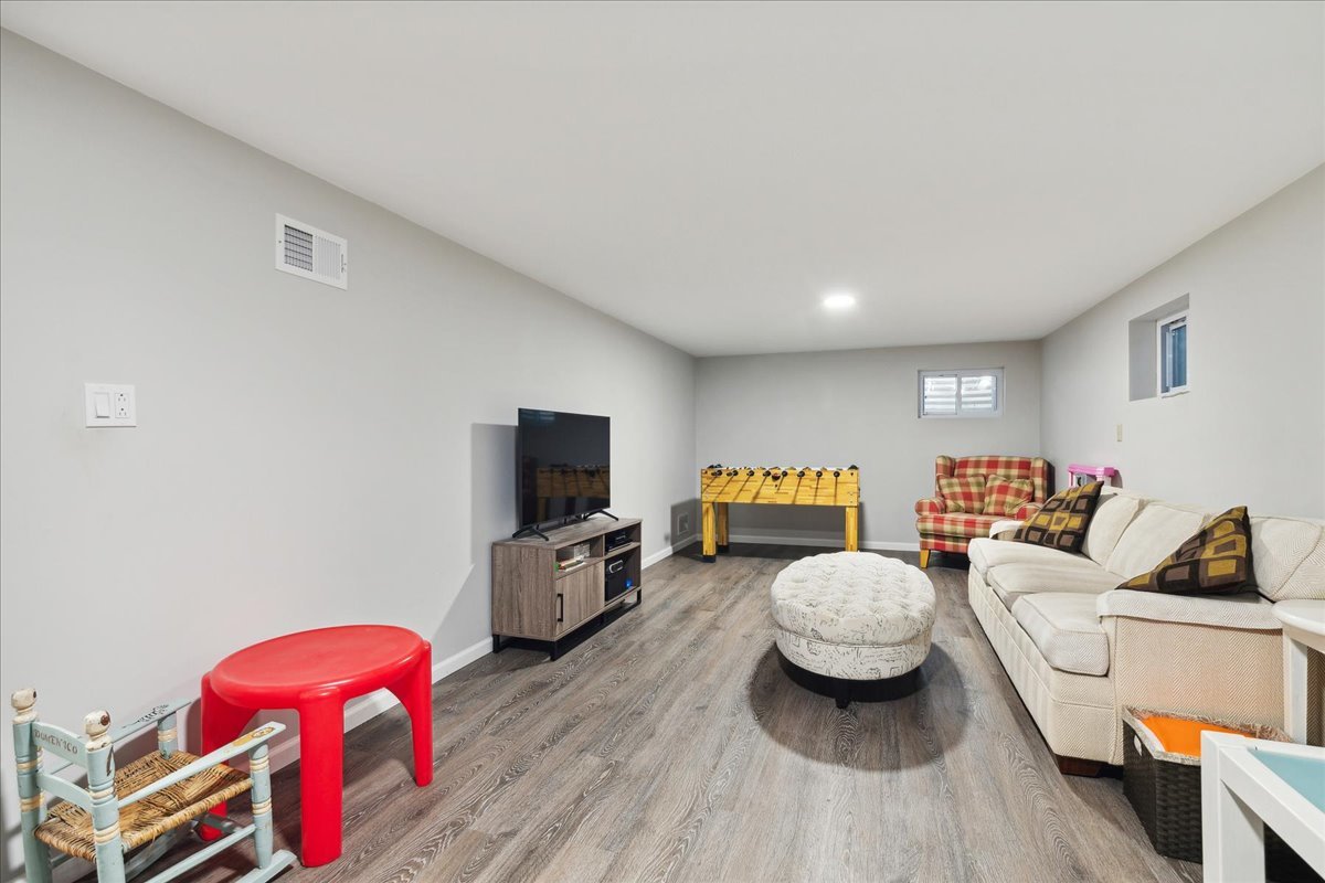 203 Pine Street Deerfield, IL 60015 - Photo 17 of 24 a living room with furniture and a flat screen tv