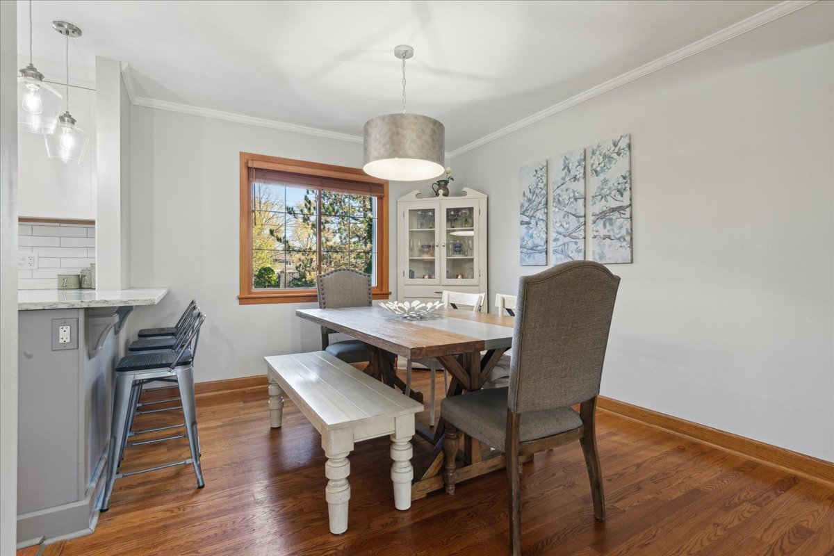 203 Pine Street Deerfield, IL 60015 - Photo 5 of 24 a view of a dining room with furniture window and wooden floor