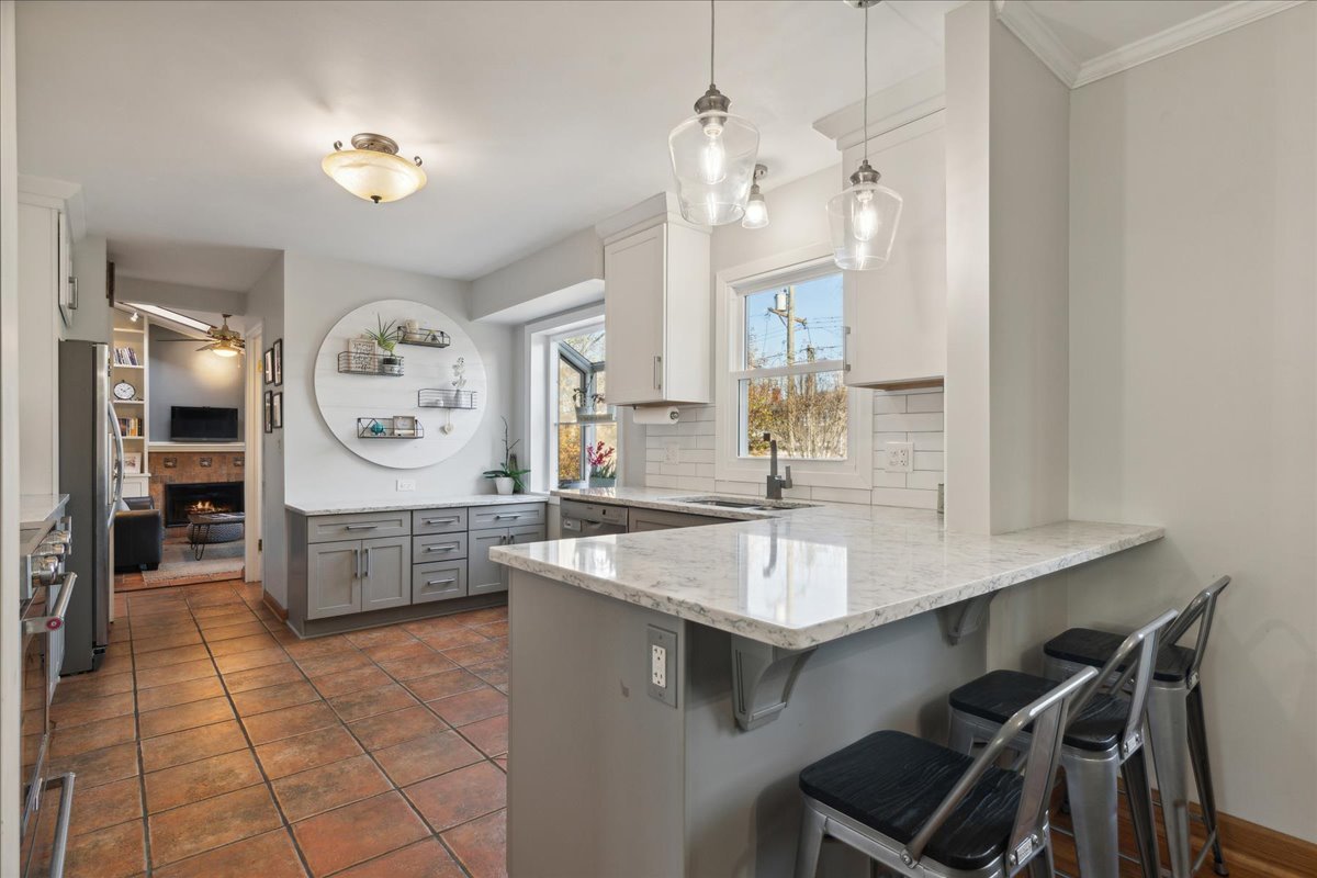 203 Pine Street Deerfield, IL 60015 - Photo 9 of 24 a kitchen with a counter space a sink and cabinets