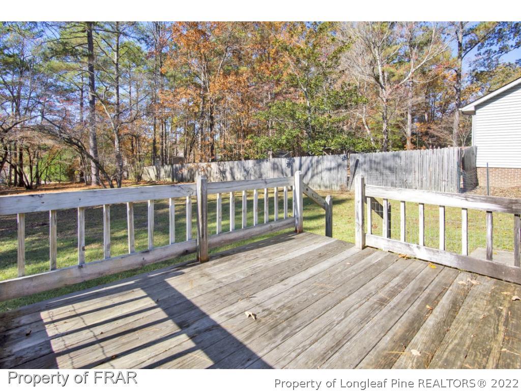 1758 Rim Road Fayetteville, NC 28314 - Photo 19 of 25 a view of a house with wooden floor and fence