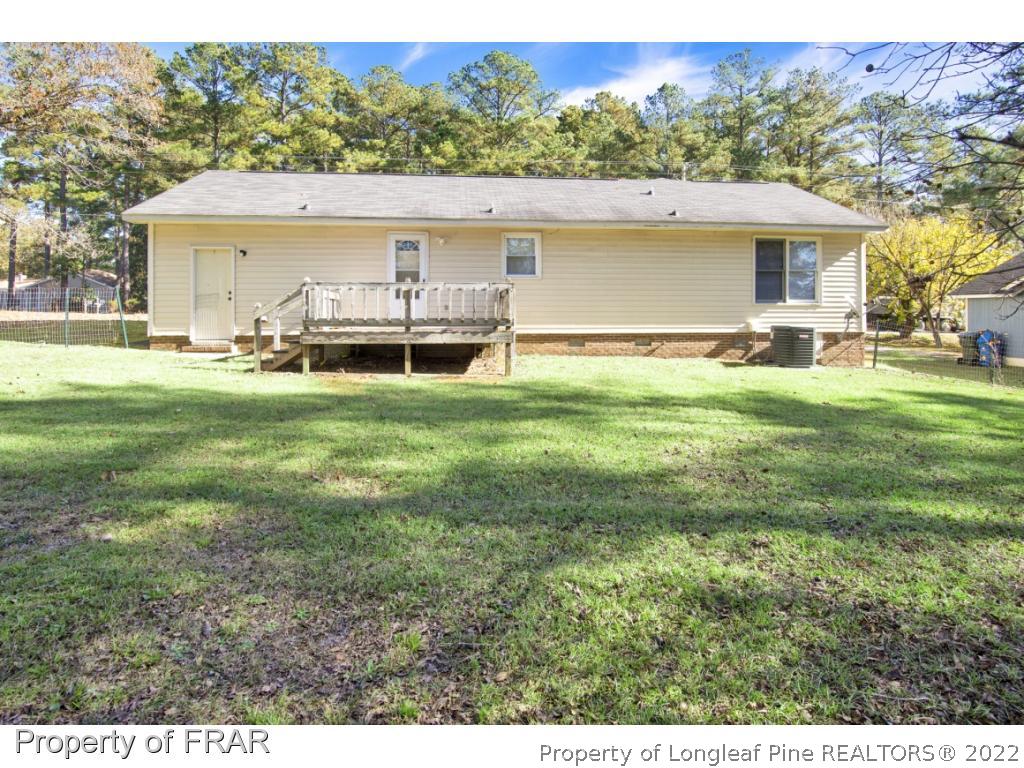 1758 Rim Road Fayetteville, NC 28314 - Photo 21 of 25 a view of a house with a yard