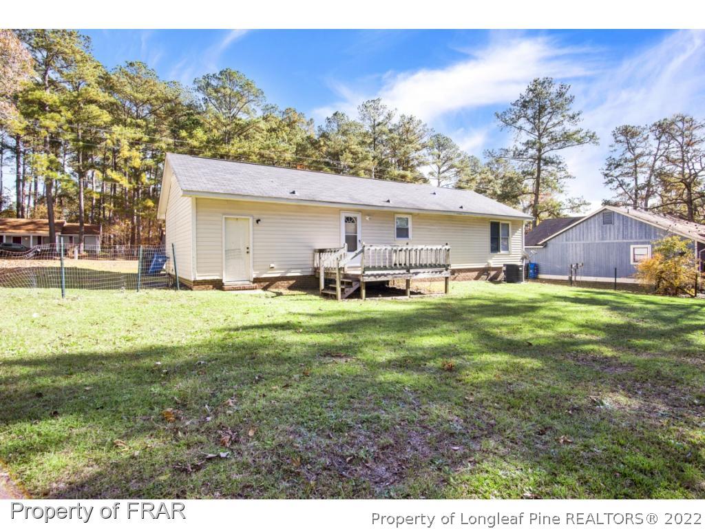 1758 Rim Road Fayetteville, NC 28314 - Photo 22 of 25 a front view of a house with garden