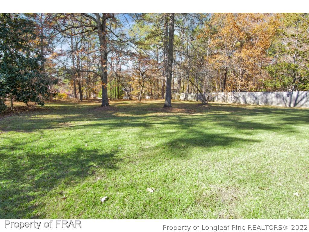 1758 Rim Road Fayetteville, NC 28314 - Photo 24 of 25 a view of a field with trees in the background
