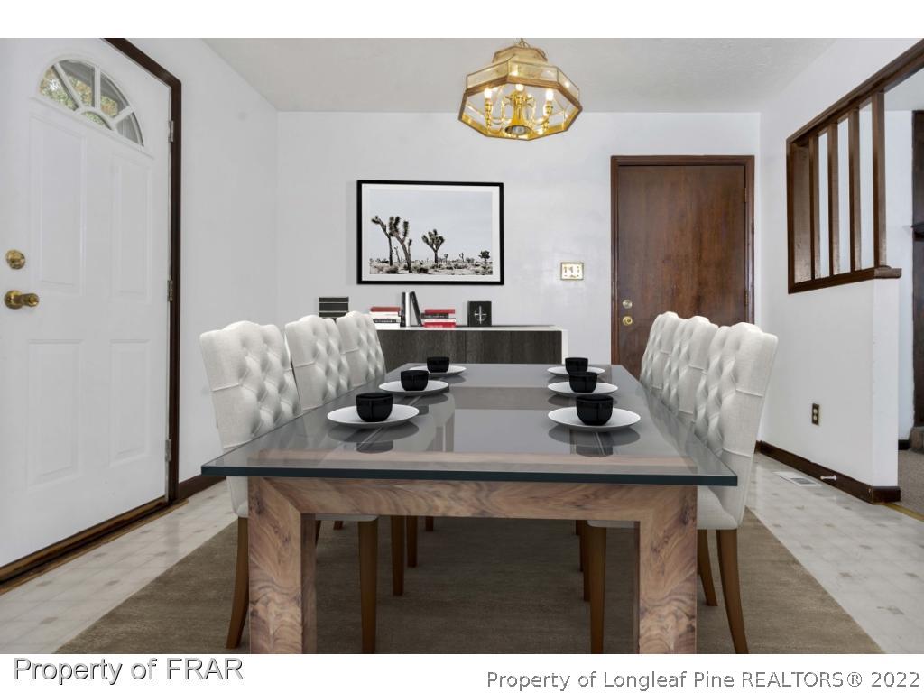 1758 Rim Road Fayetteville, NC 28314 - Photo 6 of 25 a view of a dining room with furniture and wooden floor