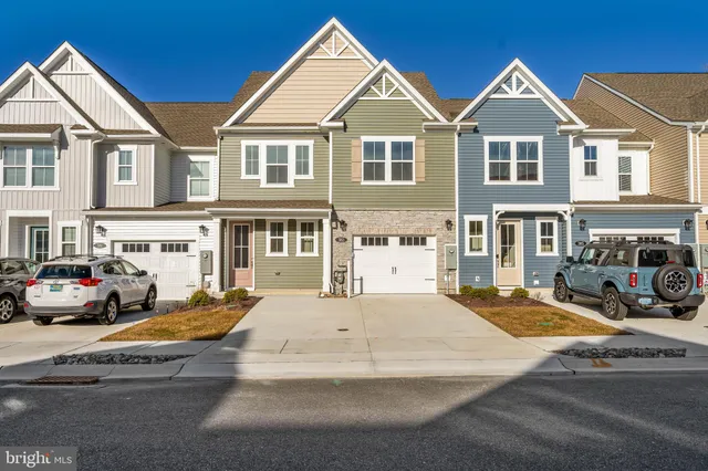 a view of multiple houses with a yard