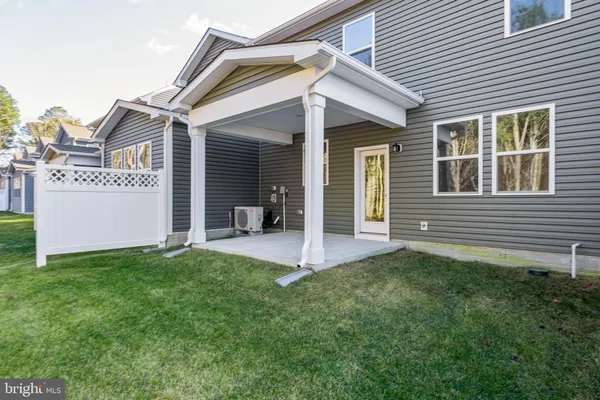 a view of a house with a yard and garage