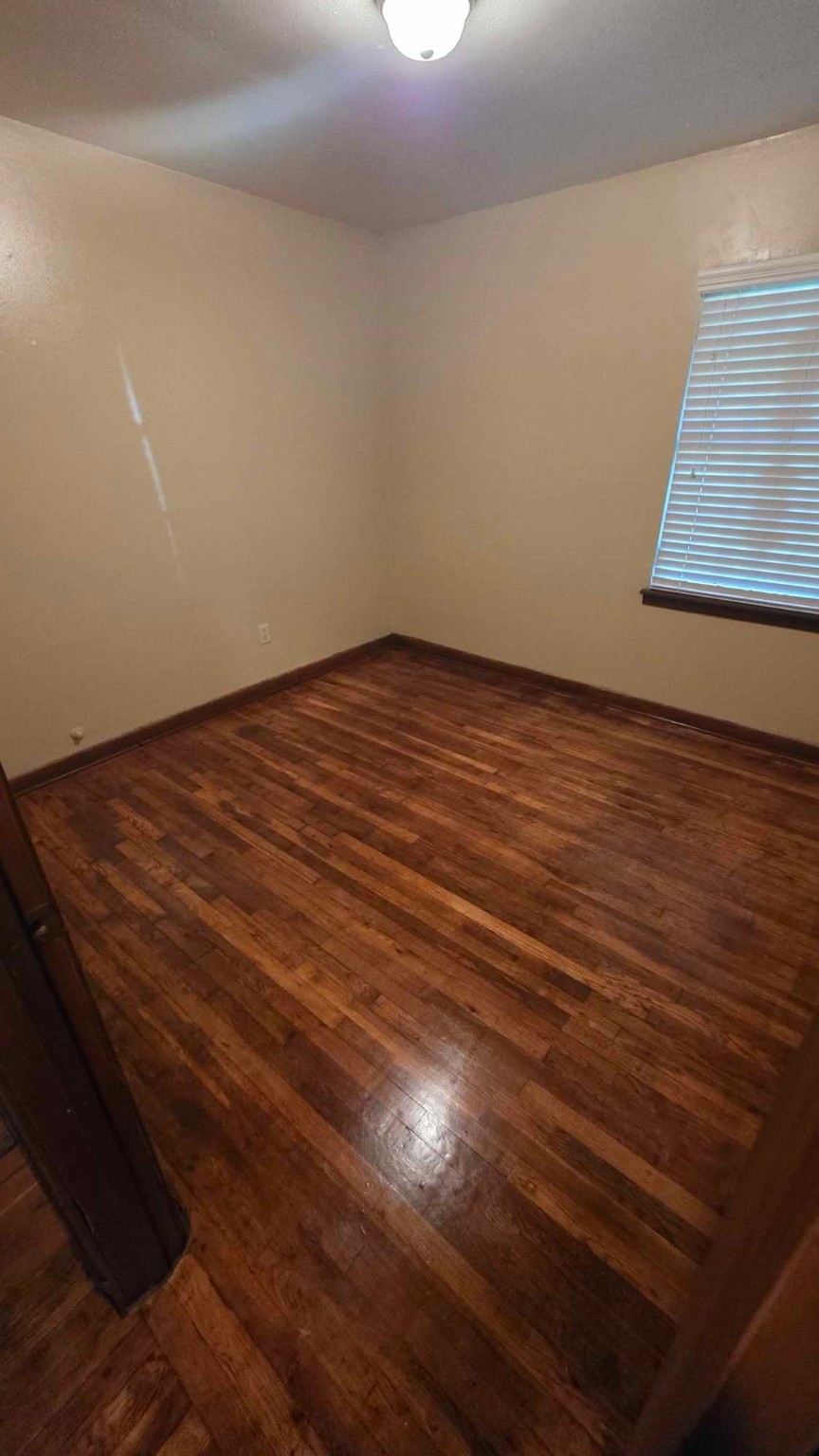 4532 Briscoe Street Houston, TX 77051 - Photo 11 of 14 a view of empty room with wooden floor