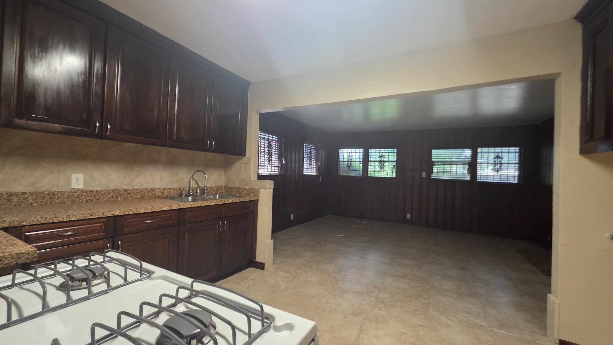 4532 Briscoe Street Houston, TX 77051 - Photo 6 of 14 a kitchen with stainless steel appliances granite countertop a stove a sink and a refrigerator