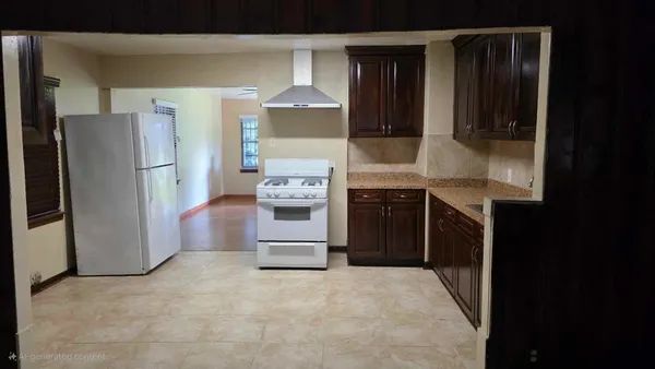 a kitchen with stainless steel appliances a refrigerator and a stove