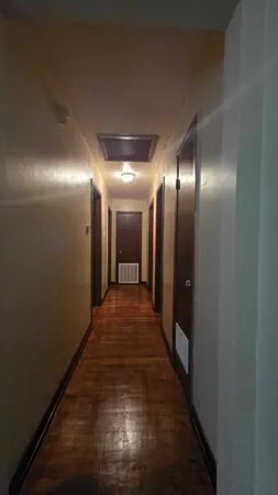 a hallway with wooden floor