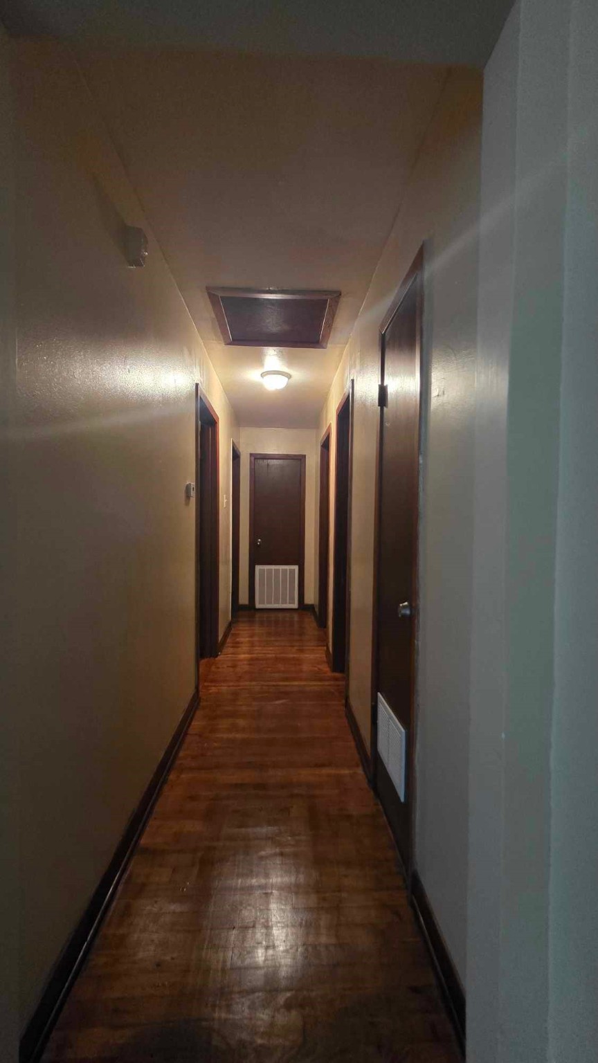 4532 Briscoe Street Houston, TX 77051 - Photo 9 of 14 a hallway with wooden floor