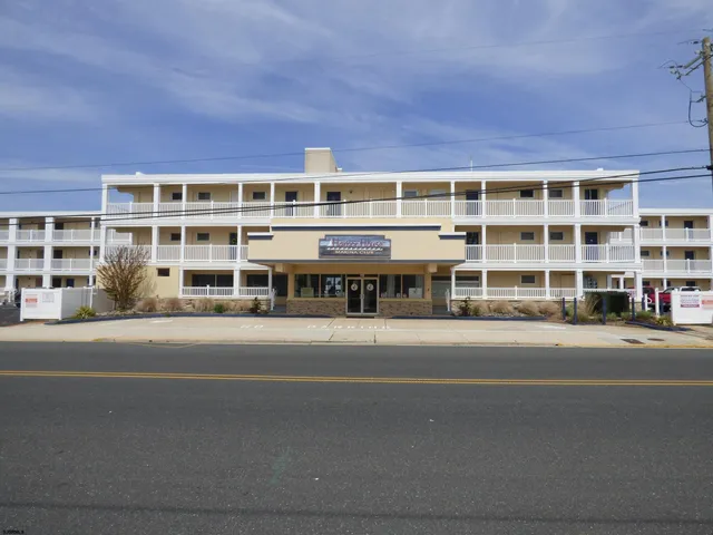 a front view of a building with a street