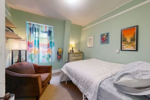 a large kitchen with cabinets wooden floor and stainless steel appliances