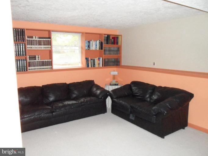 5057 Clifford Road Perry Hall, MD 21128 - Photo 9 of 13 a living room with a couch and a window