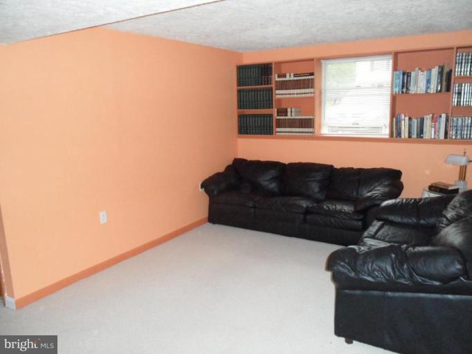 5057 Clifford Road Perry Hall, MD 21128 - Photo 10 of 13 a living room with furniture and a window