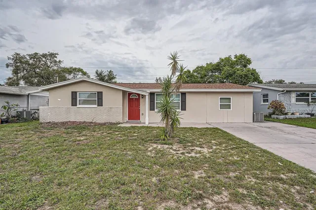 a backyard of a house with seating space