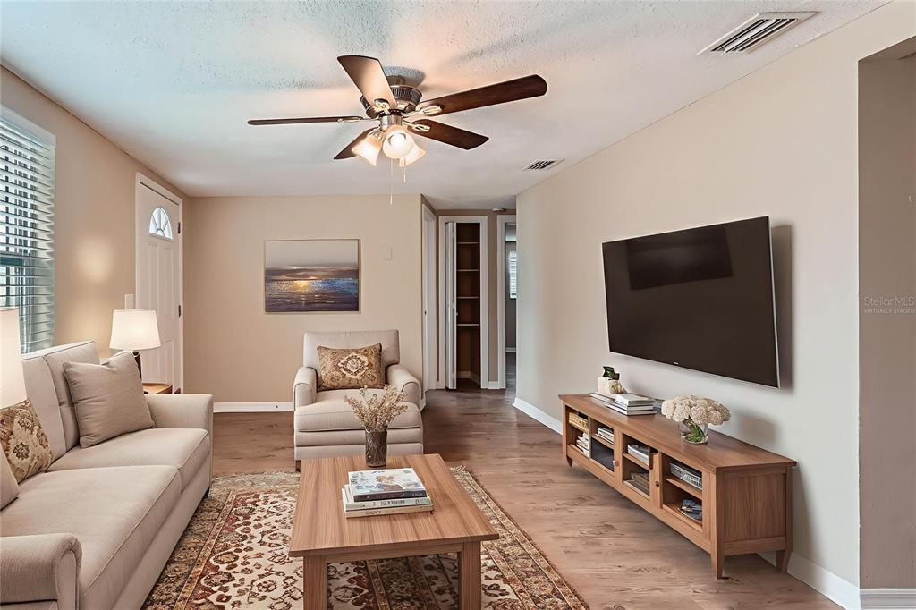 5429 Flora Avenue Holiday, FL 34690 - Photo 14 of 33 a living room with furniture and a flat screen tv