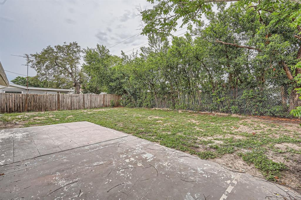 5429 Flora Avenue Holiday, FL 34690 - Photo 30 of 33 a view of a yard with wooden fence