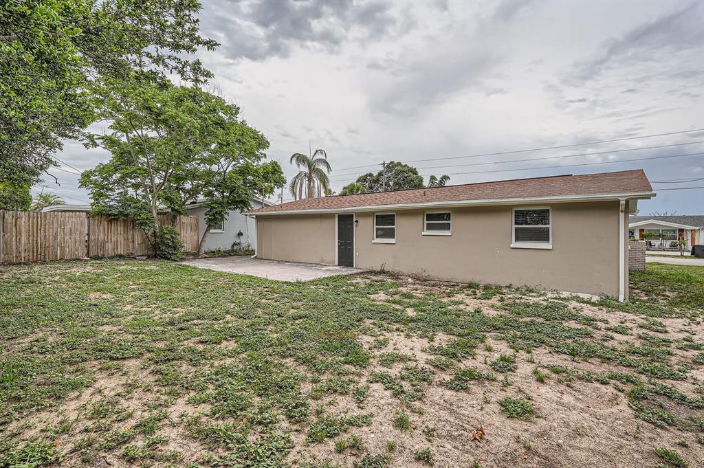 5429 Flora Avenue Holiday, FL 34690 - Photo 32 of 33 a backyard of a house