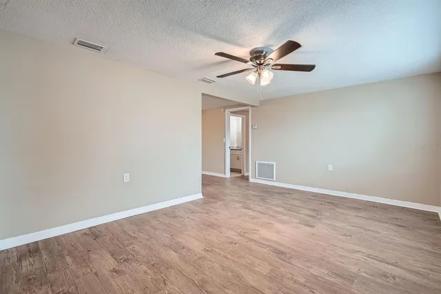 a view of an empty room with a window