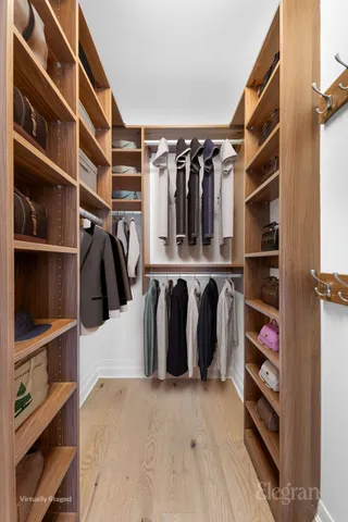 a bedroom with a bed and flat screen tv