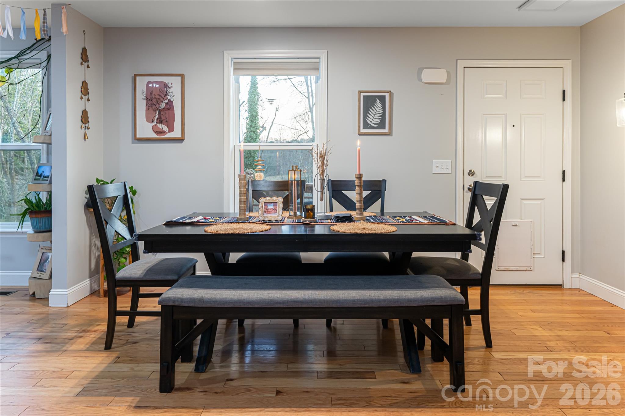 65 Owenby Road Candler, NC 28715 - Photo 21 of 48 a view of a dining room with furniture and wooden floor