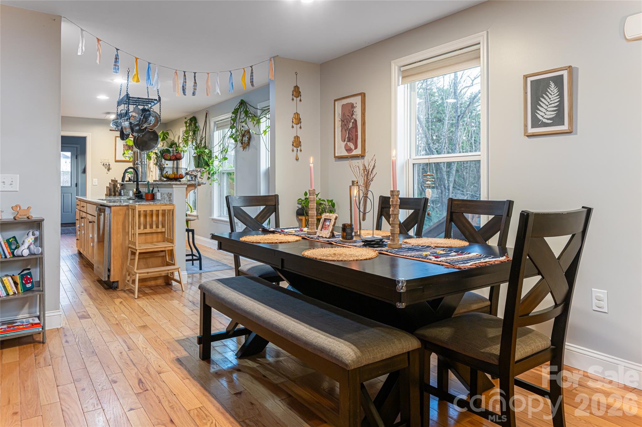 65 Owenby Road Candler, NC 28715 - Photo 22 of 48 a view of a dining room with furniture and wooden floor