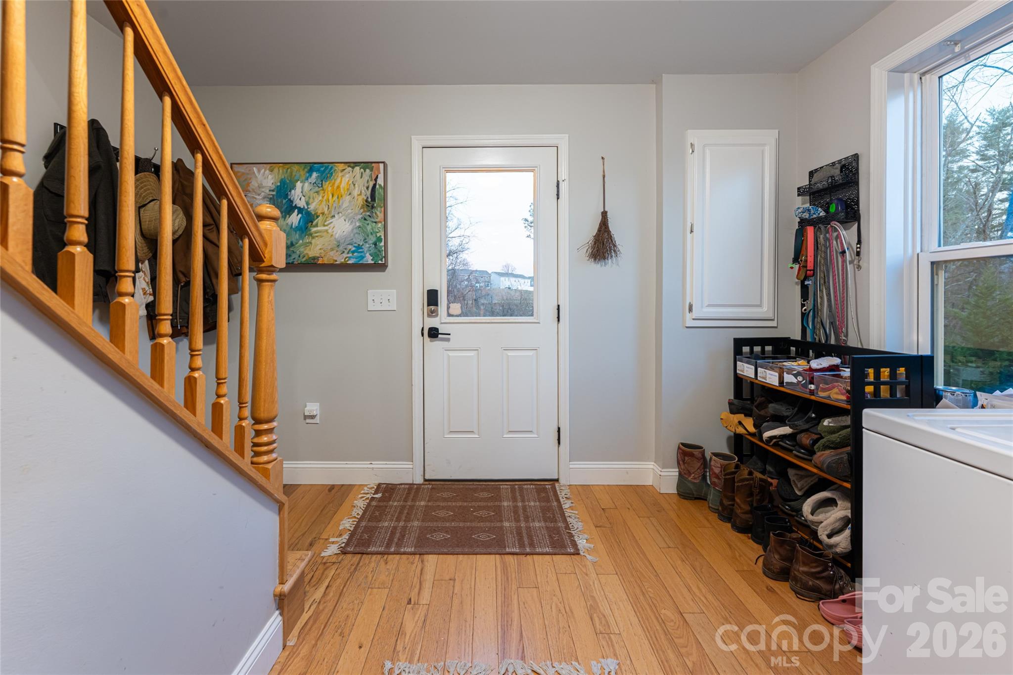 65 Owenby Road Candler, NC 28715 - Photo 35 of 48 a view of a hallway with wooden floor and staircase