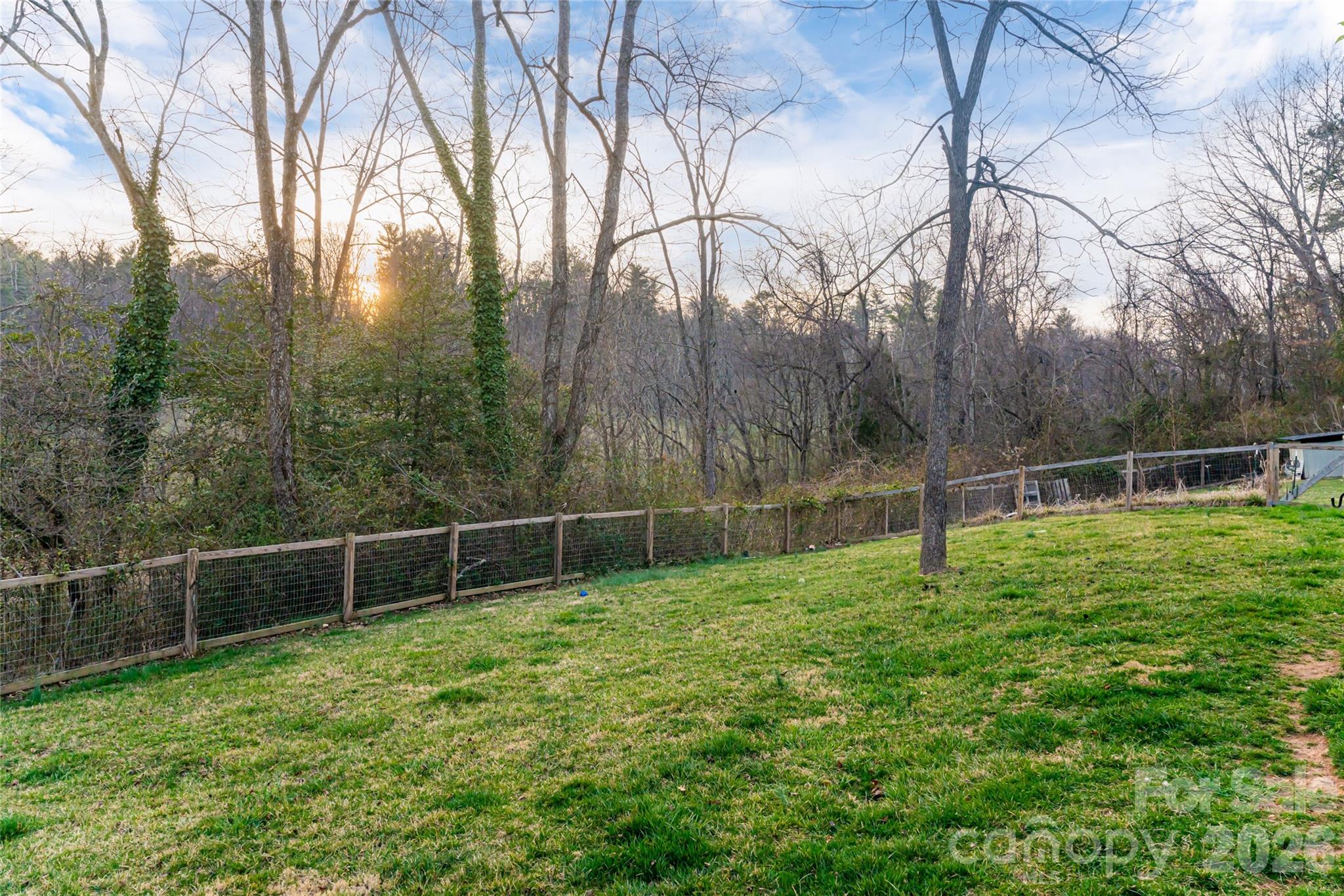 65 Owenby Road Candler, NC 28715 - Photo 7 of 48 a backyard of a house with lots of green space