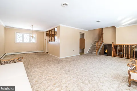 a view of a livingroom with a staircase