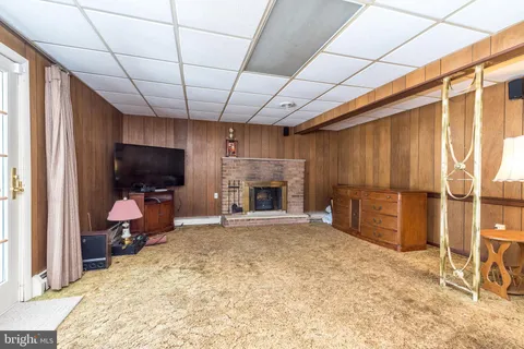 a view of a livingroom with furniture and a fireplace