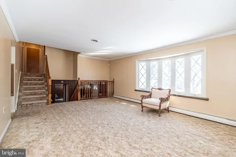 a living room with furniture and windows
