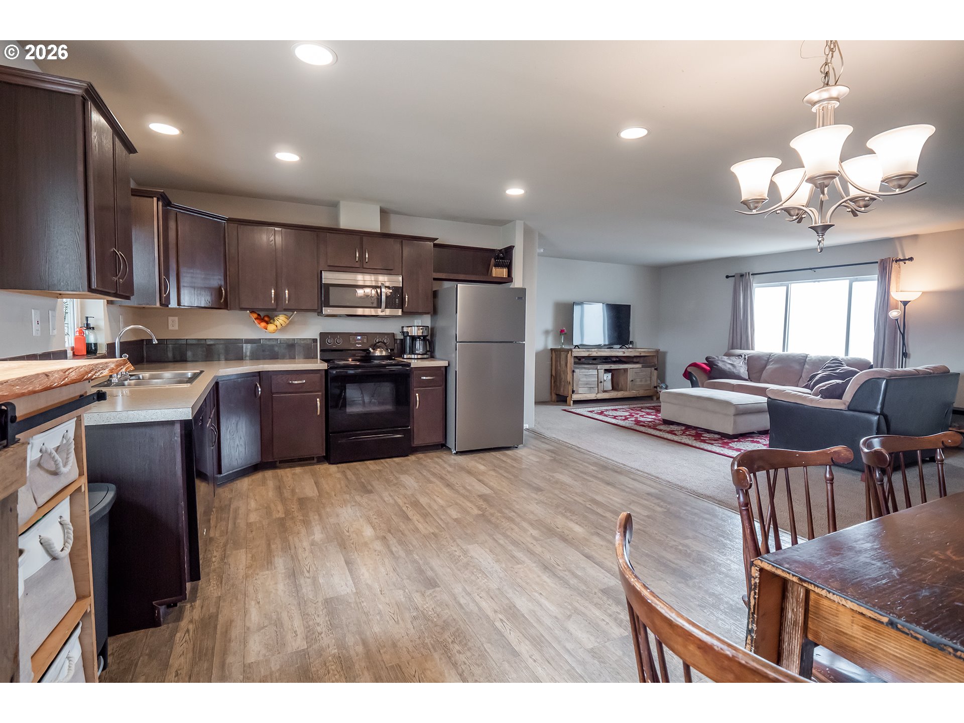 628 Stanley Lane Harrisburg, OR 97446 - Photo 11 of 32 a open kitchen with cabinets a sink and stainless steel appliances