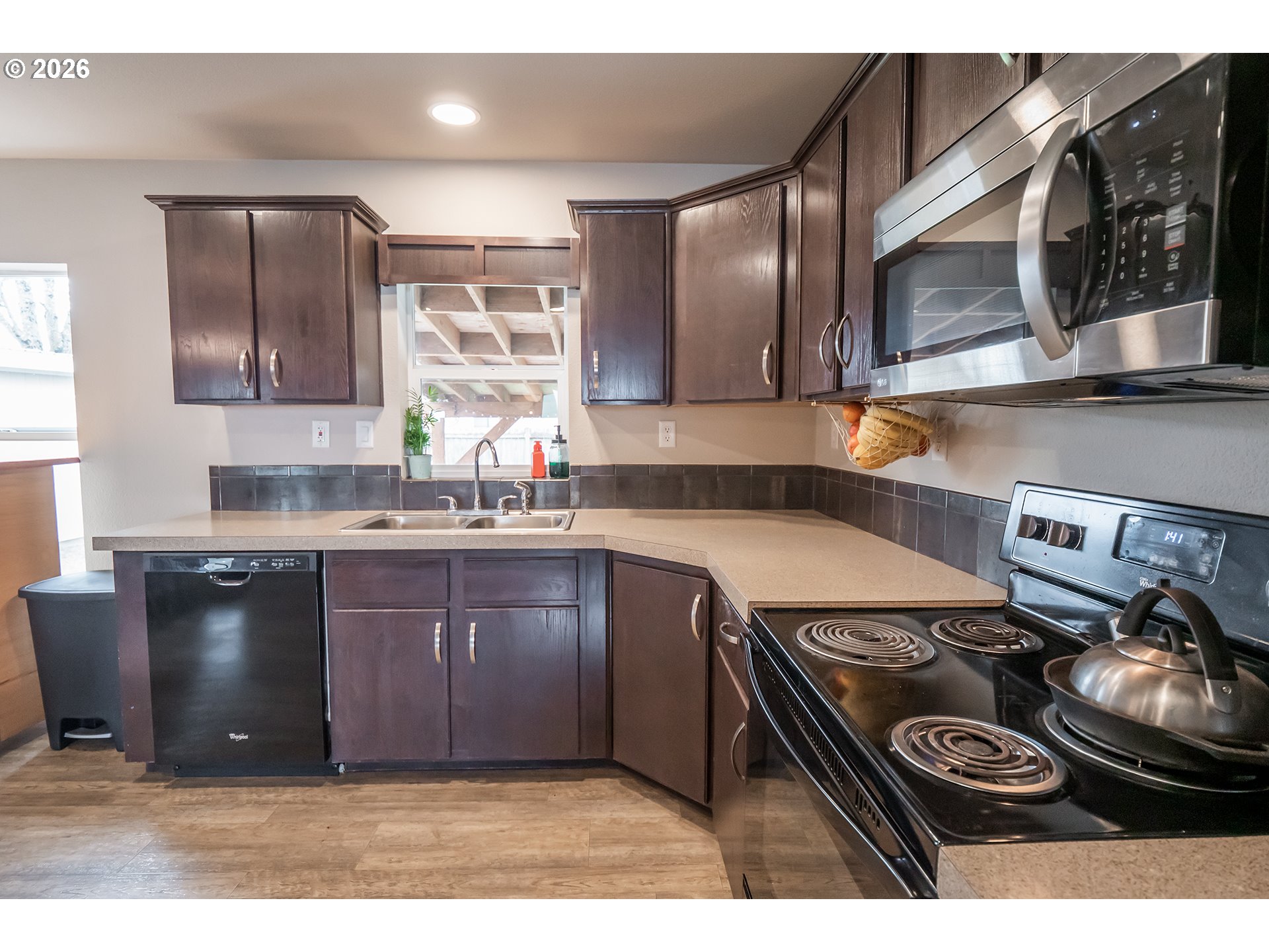 628 Stanley Lane Harrisburg, OR 97446 - Photo 12 of 32 a kitchen with a stove and a sink