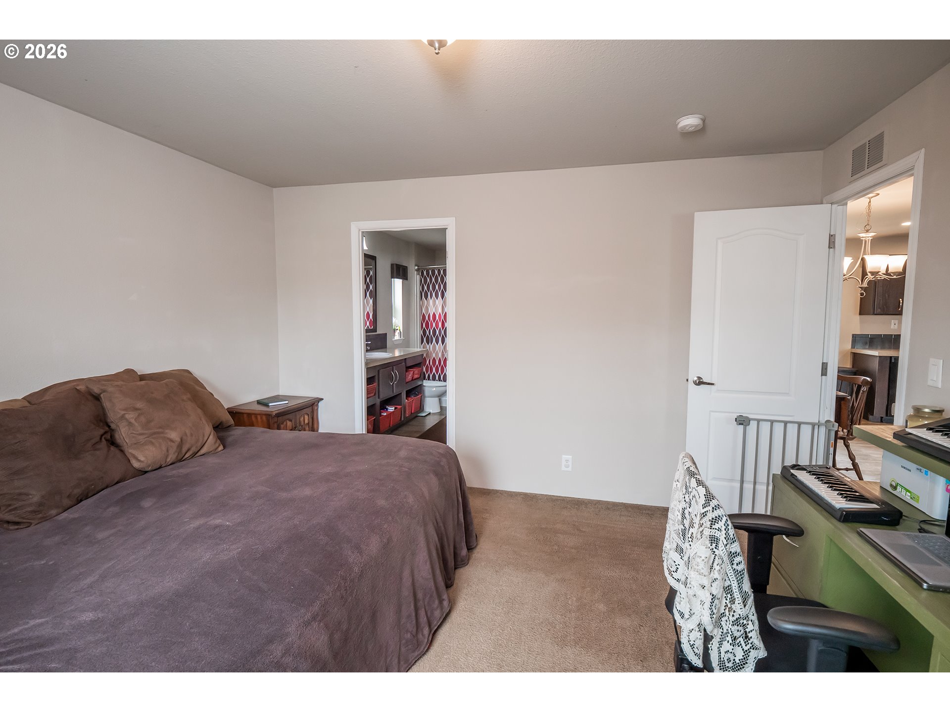 628 Stanley Lane Harrisburg, OR 97446 - Photo 14 of 32 a bedroom with a bed and a night stand