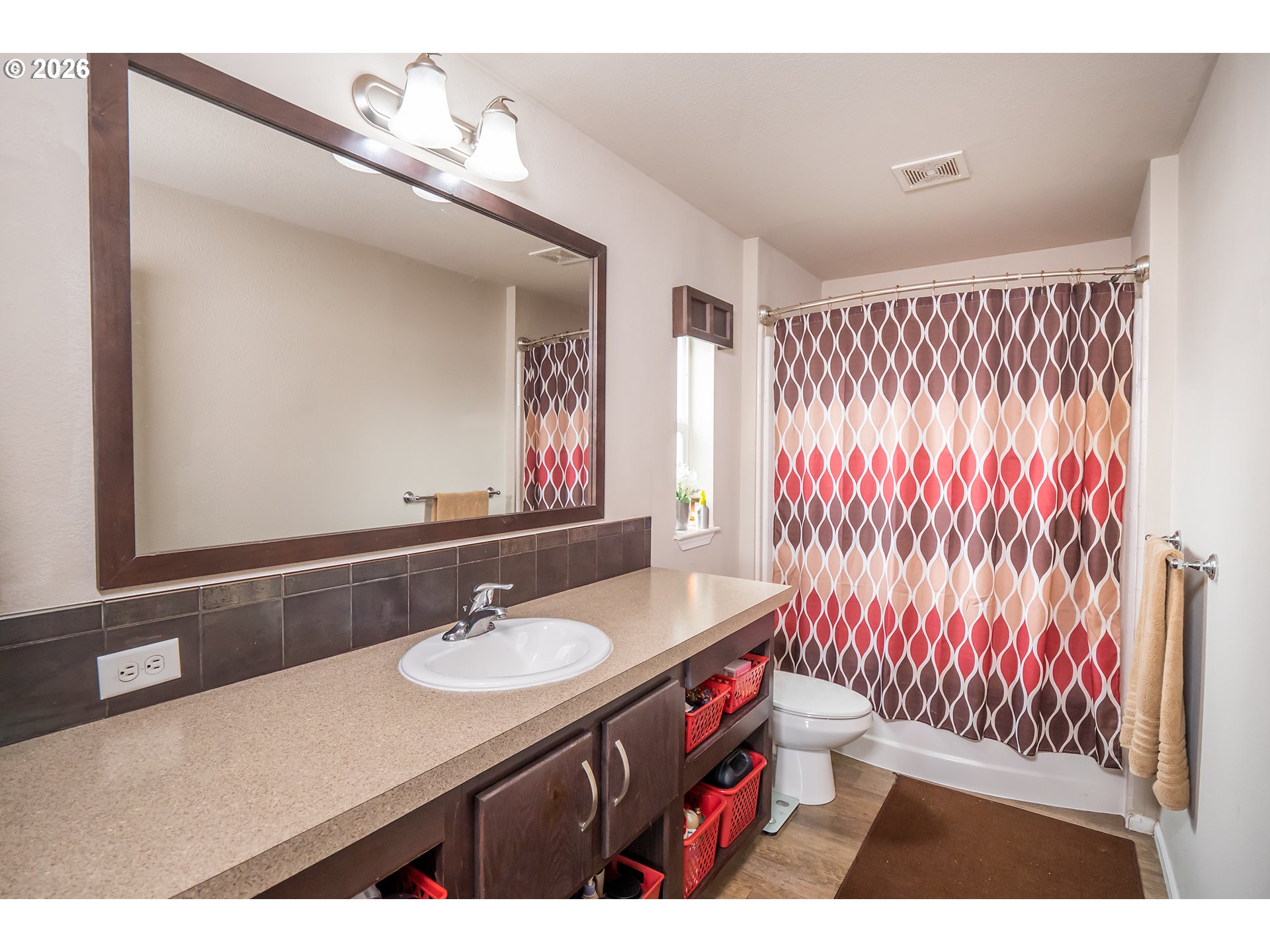 628 Stanley Lane Harrisburg, OR 97446 - Photo 16 of 32 a bathroom with a sink vanity granite and a mirror