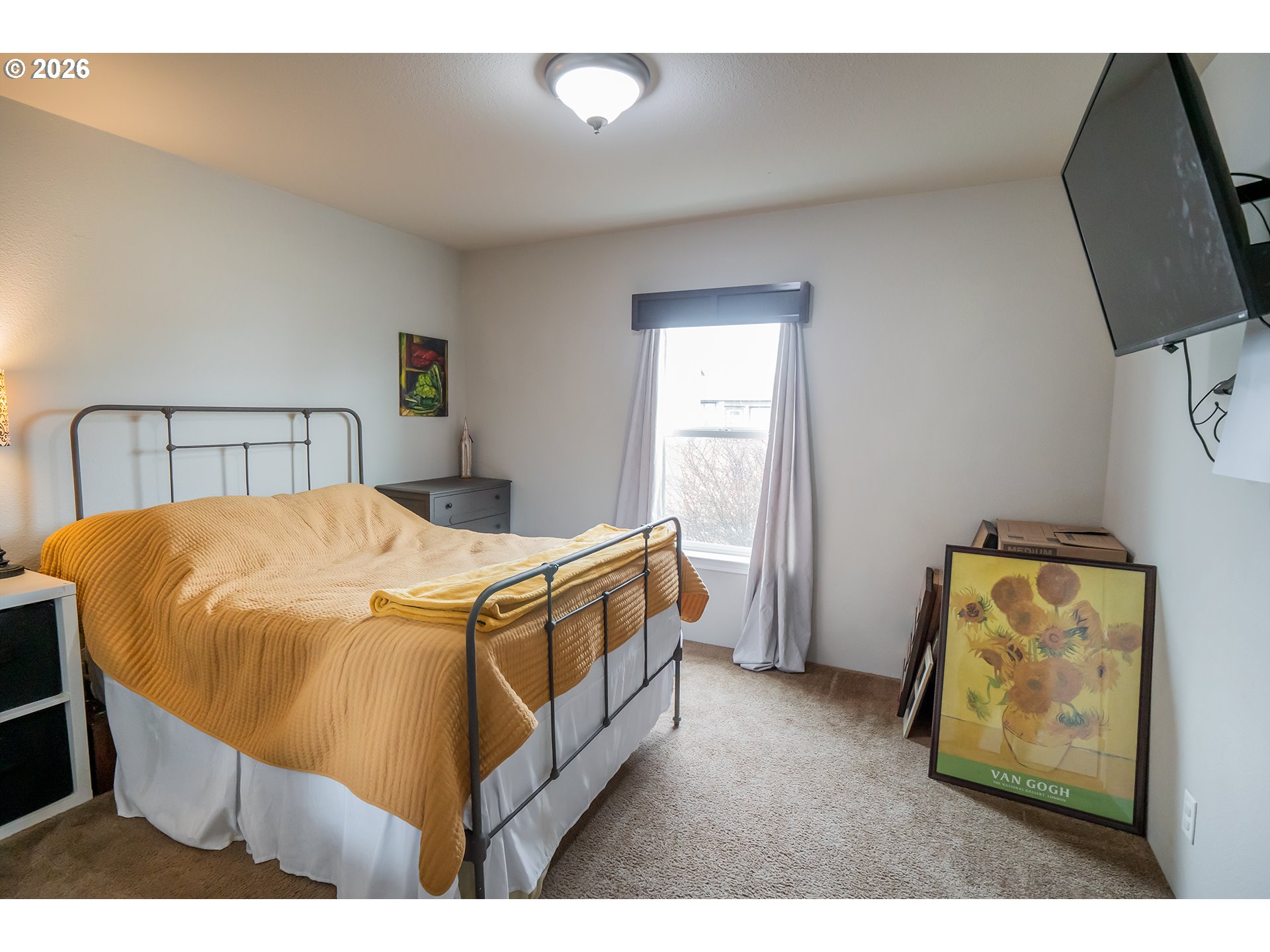 628 Stanley Lane Harrisburg, OR 97446 - Photo 18 of 32 a bed sitting in a bedroom next to a window