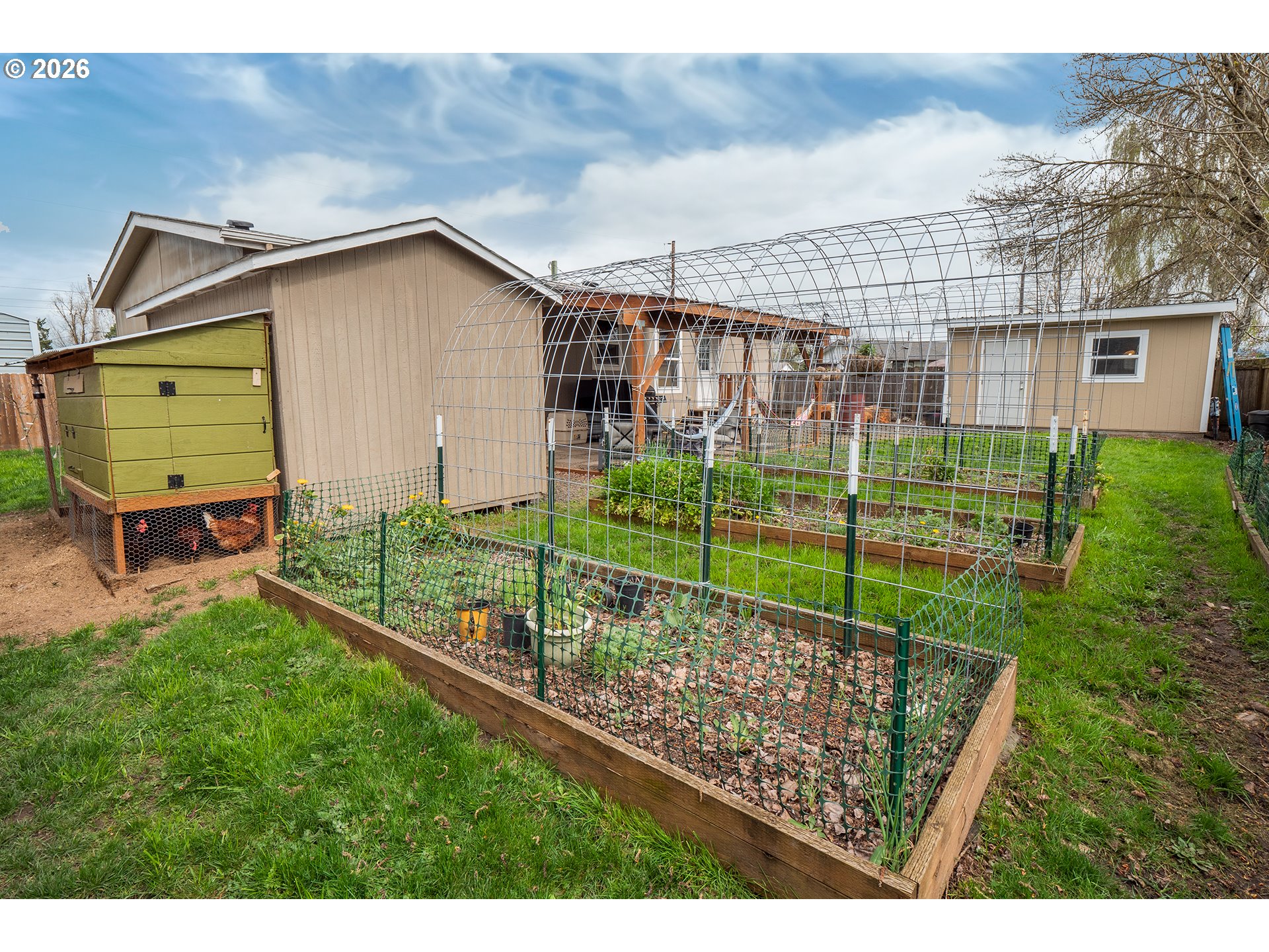 628 Stanley Lane Harrisburg, OR 97446 - Photo 29 of 32 a view of a backyard with a garden and plants