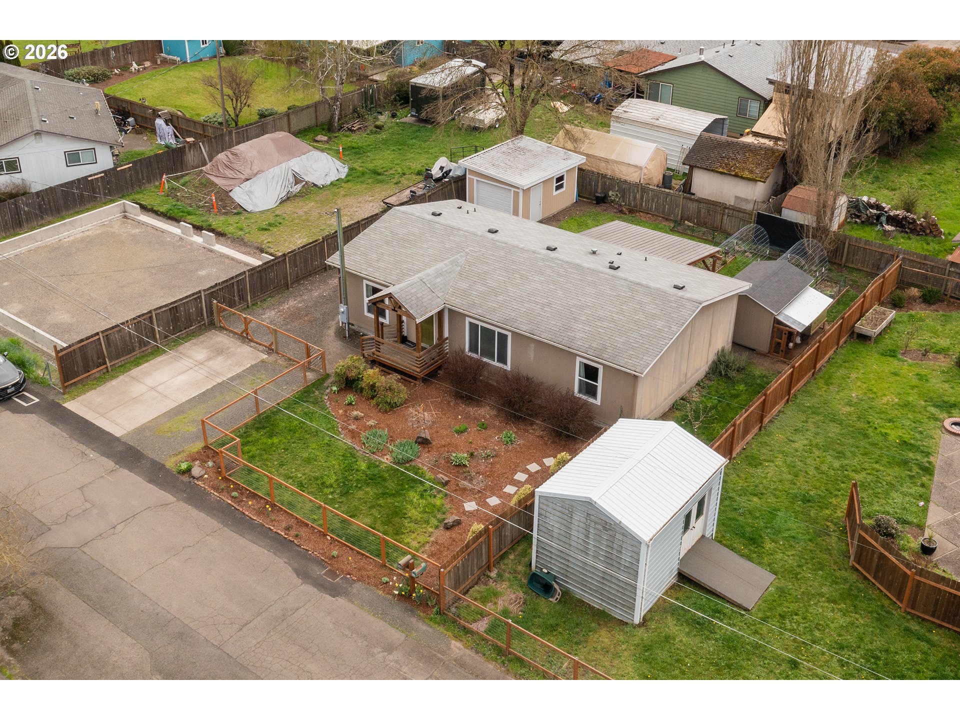 628 Stanley Lane Harrisburg, OR 97446 - Photo 4 of 32 an aerial view of a house with garden space and street view