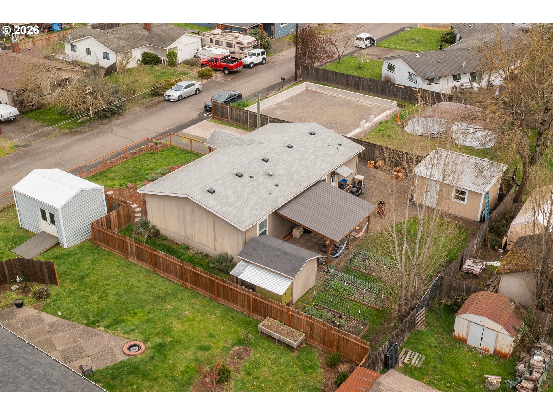 628 Stanley Lane Harrisburg, OR 97446 - Photo 5 of 32 an aerial view of a house with a garden and mountain view