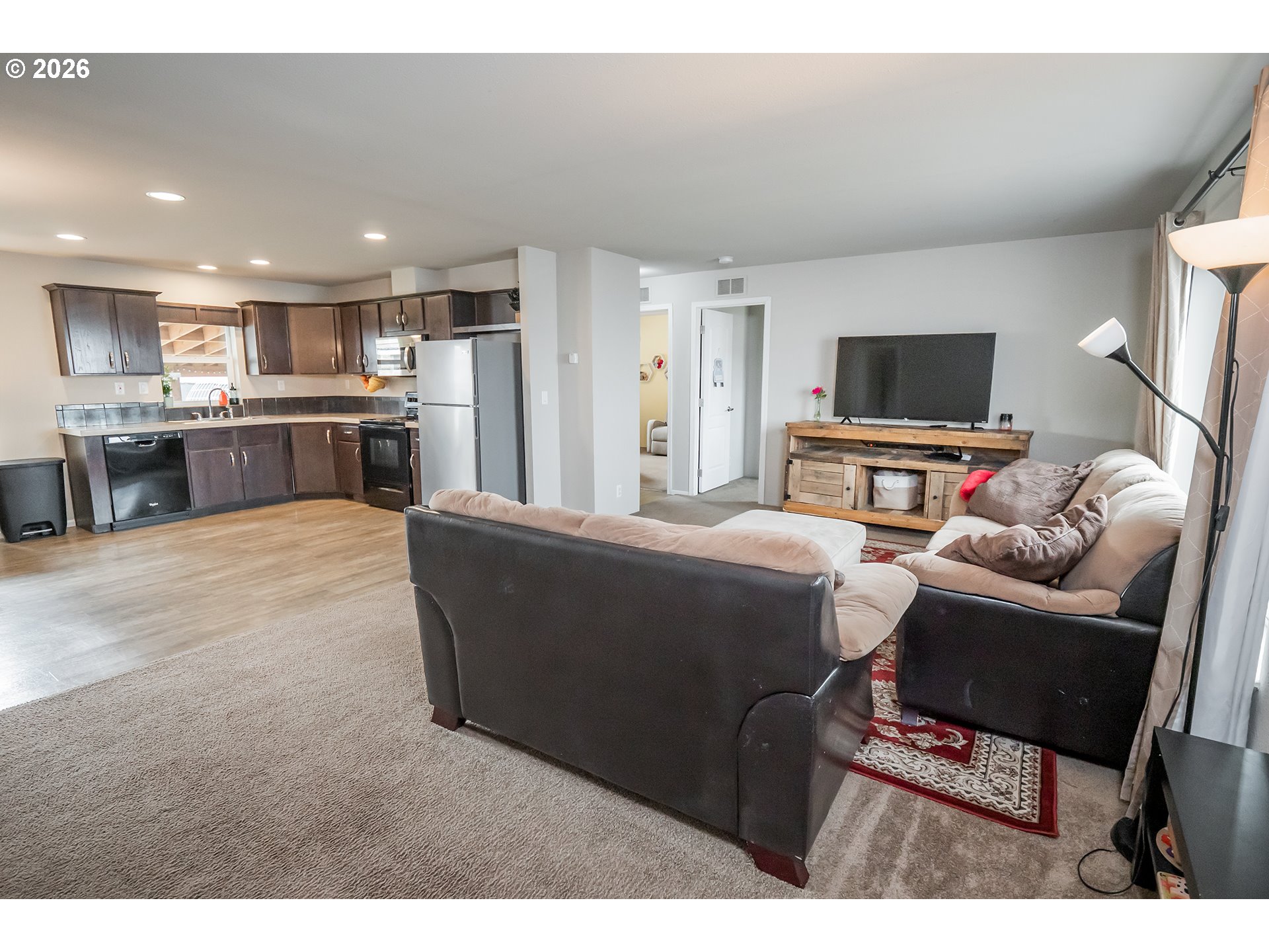 628 Stanley Lane Harrisburg, OR 97446 - Photo 6 of 32 a living room with furniture and a flat screen tv